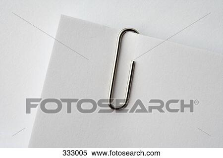 Stock Photography - Paper clip on corner of paper. Fotosearch