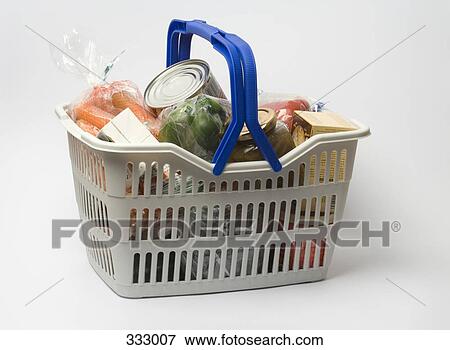 Shopping basket full of groceries View Large Photo Image Stock Photo - Shopping basket full of groceries. Fotosearch