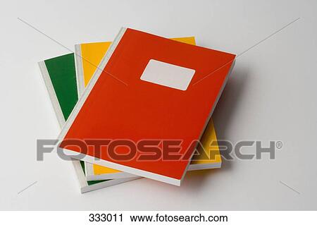 Stock Image - Stack of three colored workbooks. Fotosearch