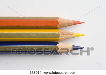 Three colored pencils in a row View Large Photo Image Picture - Three colored pencils in a row. Fotosearch