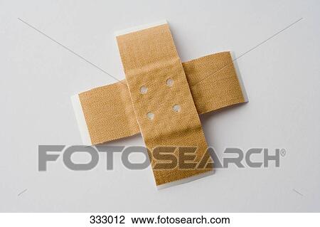 Two adhesive bandages in cross shape View Large Photo Image Stock Image - Two adhesive bandages in cross shape. Fotosearch