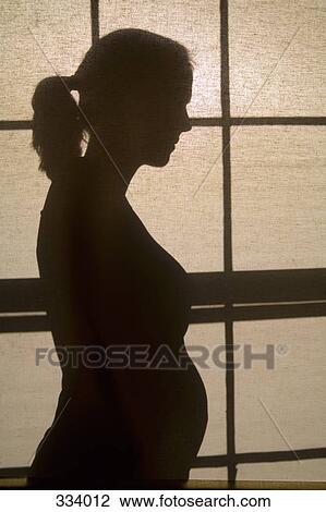 Silhouette of pregnant woman View Large Photo Image Stock Image - Silhouette of pregnant woman. Fotosearch