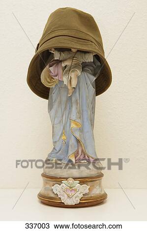 Hat covering figurine of Jesus and the Virgin Mary View Large Photo Image Stock Image - Hat covering figurine of Jesus and the Virgin Mary. Fotosearch