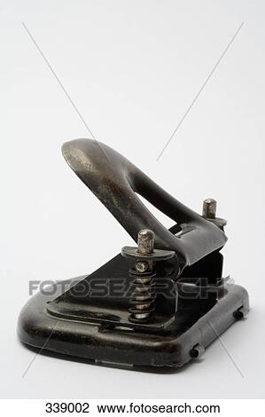 Stock Image - Black metal hole punch. Fotosearch