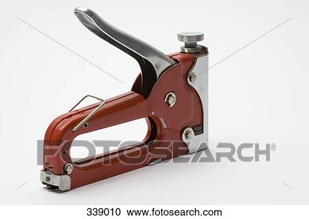 Stock Image - Red metal stapler. Fotosearch