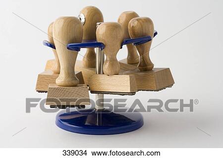 Picture - Wooden hand stamps on rack. Fotosearch