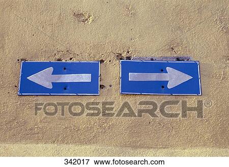Arrow signs on wall View Large Photo Image Stock Photo - Arrow signs on wall. Fotosearch