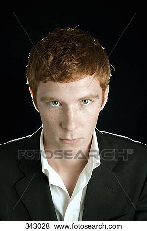 Stock Photo - Portrait of young man with red hair. Fotosearch