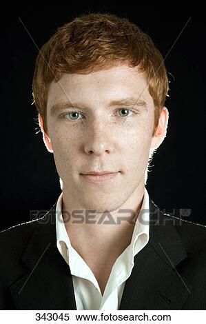 Portrait of young man with red hair smiling View Large Photo Image Stock Photography - Portrait of young man with red hair smiling. Fotosearch