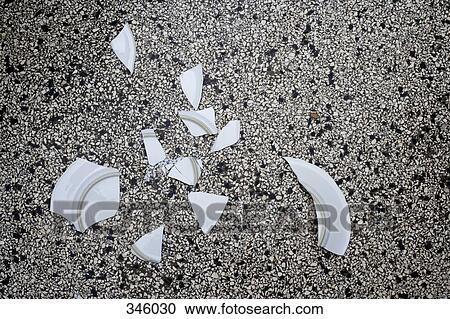 Stock Image - Broken plate on floor. Fotosearch