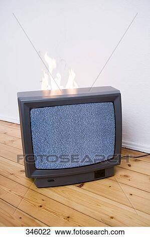 Flames behind television View Large Photo Image Stock Image - Flames behind television. Fotosearch
