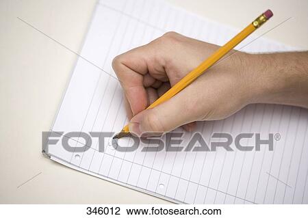Man holding pencil with broken lead on lined paper View Large Photo Image Stock Image - Man holding pencil with broken lead on lined paper. Fotosearch