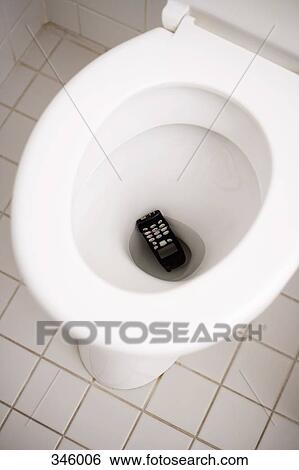 Stock Photograph - Mobile phone dropped down toilet. Fotosearch