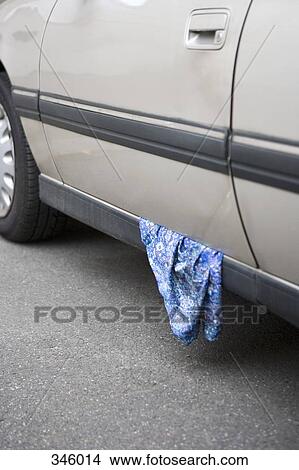 Skirt stuck in car door View Large Photo Image Picture - Skirt stuck in car door. Fotosearch
