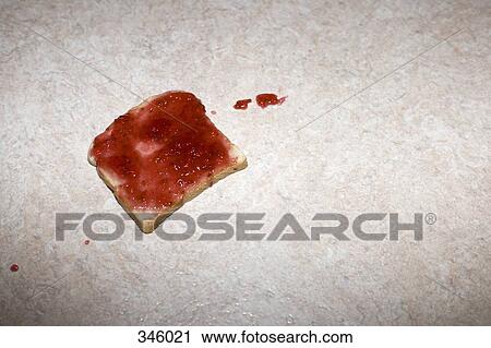 Slice of toast with strawberry jam dropped on the floor View Large Photo Image Stock Image - Slice of toast with strawberry jam dropped on the floor. Fotosearch