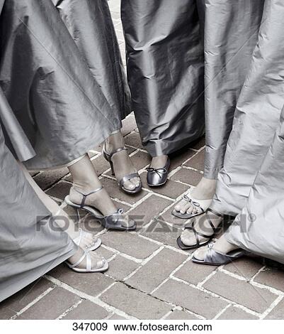 Bridesmaids standing with feet in a circle View Large Photo Image Stock Photo - Bridesmaids standing with feet in a circle. Fotosearch