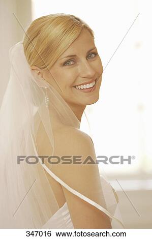 Portrait of a bride looking over her shoulder View Large Photo Image Stock Photograph - Portrait of a bride looking over her shoulder. Fotosearch