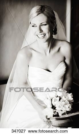 Portrait of bride holding wedding bouquet and looking away View Large Photo Image Stock Photo - Portrait of bride holding wedding bouquet and looking away. Fotosearch