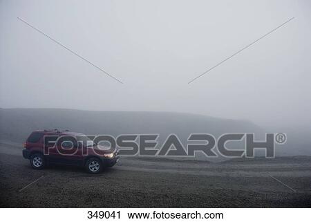 Car driving along foggy mountain road, Iceland View Large Photo Image Stock Image - Car driving along foggy mountain road, Iceland. Fotosearch