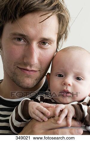 Stock Image - Father holding child. Fotosearch