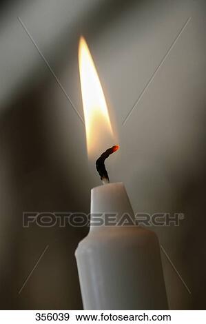 A candle burning View Large Photo Image Stock Photo - A candle burning. Fotosearch