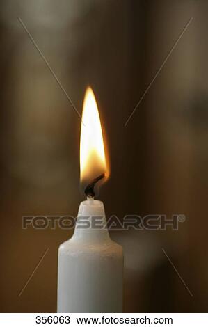 Close-up of a candle burning View Large Photo Image Stock Image - Close-up of a candle burning. Fotosearch