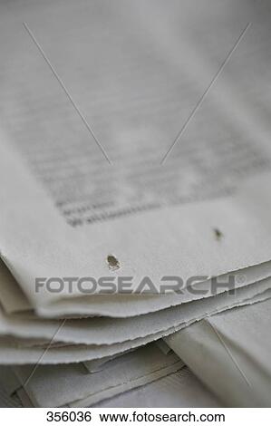 Stock Photograph - Close-up of corner of newspaper. Fotosearch