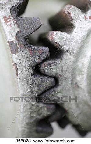 Close-up of two rusty cogs View Large Photo Image Stock Photo - Close-up of two rusty cogs. Fotosearch