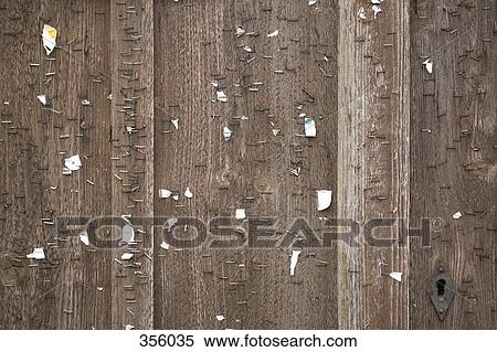 Stock Photography - Close-up of weathered door with staples. Fotosearch
