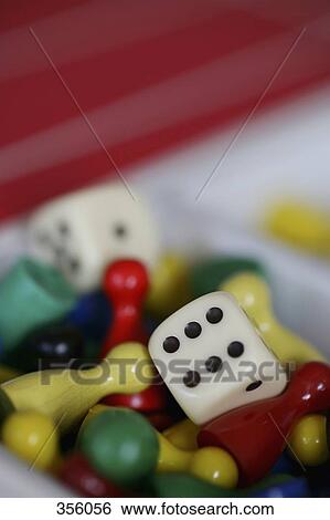 Heap of game pieces and dice View Large Photo Image Stock Photograph - Heap of game pieces and dice. Fotosearch