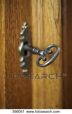 Key in wooden door View Large Photo Image Stock Image - Key in wooden door. Fotosearch
