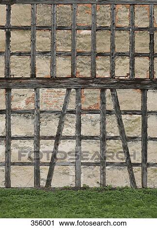 Side wall of old building with wooden beams View Large Photo Image Stock Image - Side wall of old building with wooden beams. Fotosearch