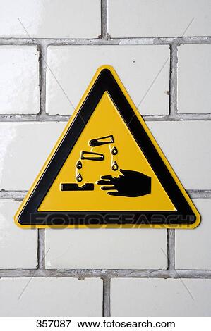 ‘Corrosive’ warning sign on wall View Large Photo Image Stock Photo - ‘Corrosive’ warning sign on wall. Fotosearch