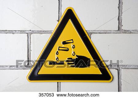 Stock Image - ‘Corrosive’ warning sign. Fotosearch
