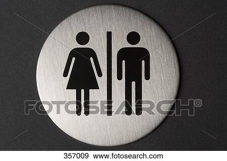 Stock Photo - Female and male sign on toilet door. Fotosearch