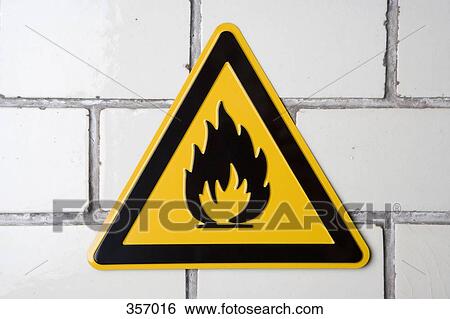 Stock Photograph - ‘Flammable’ warning sign on wall. Fotosearch