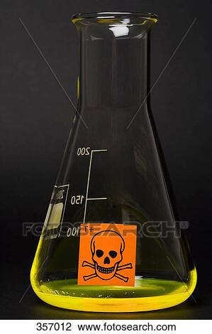 Stock Image - Toxic label on conical flask containing yellow liquid. Fotosearch