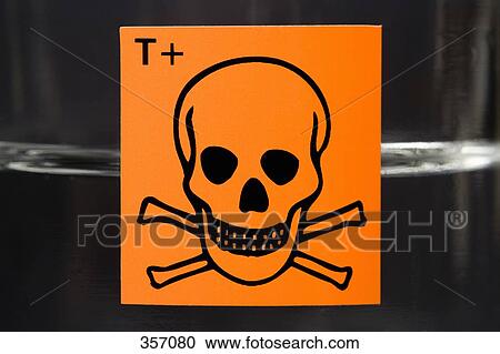 Toxic substance label with skull and crossbones on glass flask containing liquid View Large Photo Image Stock Image - Toxic substance label with skull and crossbones on glass flask containing liquid. Fotosearch