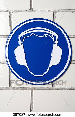 Stock Photo - ‘Wear ear protectors’ caution sign. Fotosearch