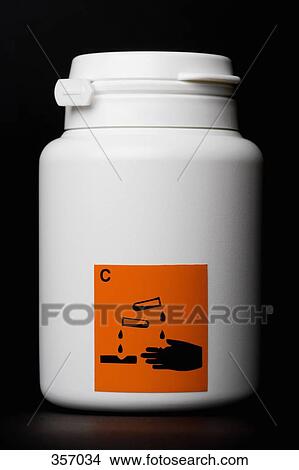 White bottle with ‘corrosive’ warning label View Large Photo Image Picture - White bottle with ‘corrosive’ warning label. Fotosearch