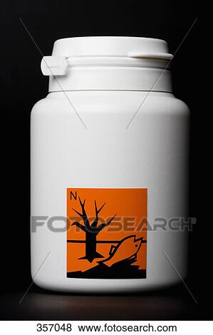 Stock Photo - White bottle with ‘nature polluting’ hazard label. Fotosearch