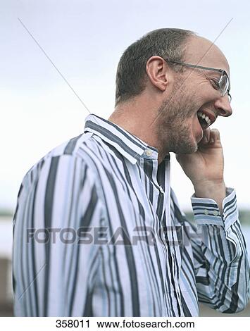 Businessman using mobile phone View Large Photo Image Stock Image - Businessman using mobile phone. Fotosearch