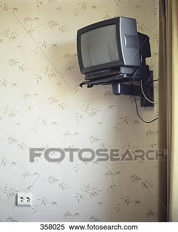 Television mounted on a wall in a hotel room View Large Photo Image Stock Photography - Television mounted on a wall in a hotel room. Fotosearch
