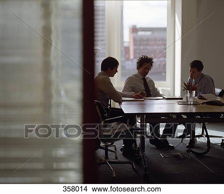 Three businessmen meeting in conference room View Large Photo Image Picture - Three businessmen meeting in conference room. Fotosearch