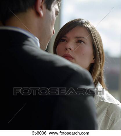 Woman and man standing face to face View Large Photo Image Stock Photograph - Woman and man standing face to face. Fotosearch