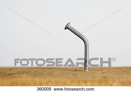 Bent nail in wood View Large Photo Image Stock Photo - Bent nail in wood. Fotosearch