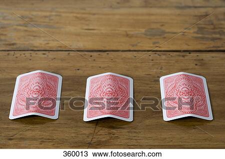 Stock Image - Three card trick. Fotosearch