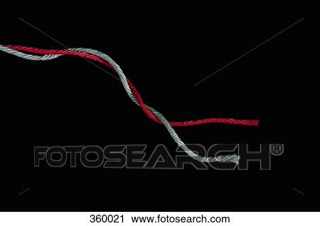 Stock Image - Two strands of wool intertwined. Fotosearch