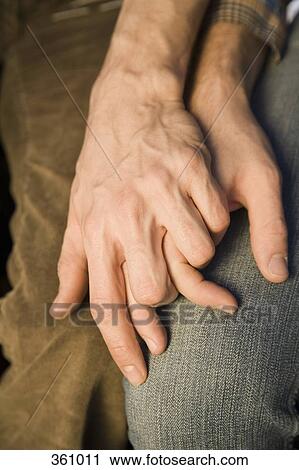 Close-up of two men holding hands View Large Photo Image Stock Image - Close-up of two men holding hands. Fotosearch