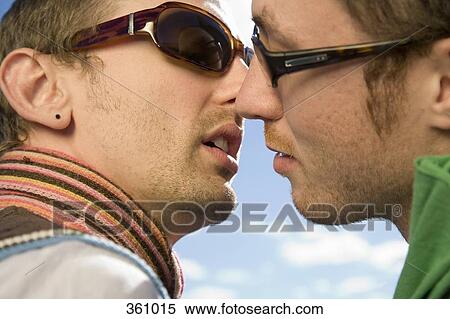 Two gay men kissing View Large Photo Image Stock Photography - Two gay men kissing. Fotosearch